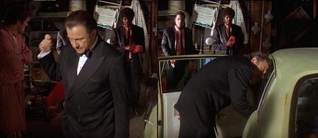 Winston Wolf in Pulp Fiction Inspecting a bloody '74 Nova...