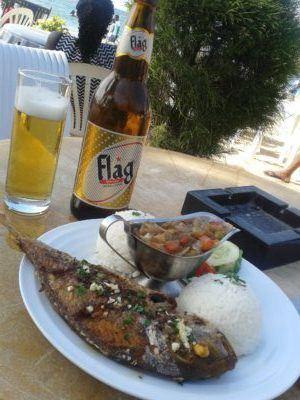 Friday’s Featured Food: Barbecued Fish and Flag Beer on N’Gor Beach, Dakar, Senegal Friday's Featured Food: Barbecued Fish and Flag Beer on N'Gor Beach, Dakar, Senegal