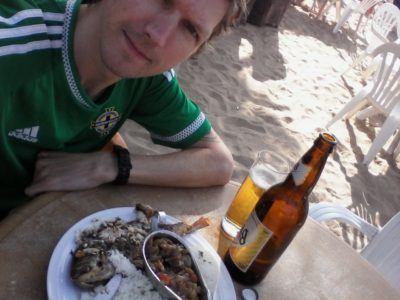 Friday’s Featured Food: Barbecued Fish and Flag Beer on N’Gor Beach, Dakar, Senegal Friday's Featured Food: Barbecued Fish and Flag Beer on N'Gor Beach, Dakar, Senegal