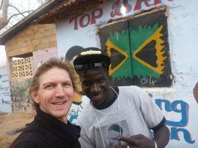 Staying at the Banana Lodge Apartments in Brufut Village, The Gambia Deco and I at his barbers