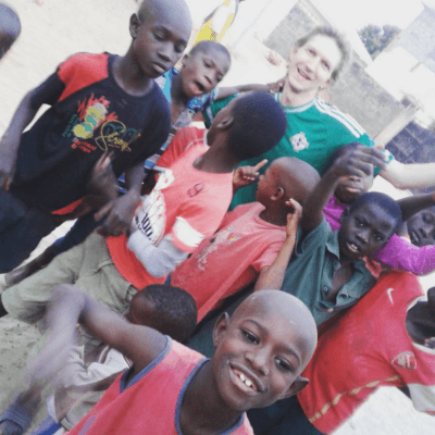 Staying at the Banana Lodge Apartments in Brufut Village, The Gambia Jonny Blair playing football with kids in Africa