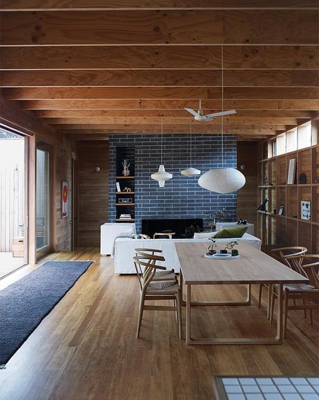 Local Wood Covers This Getaway for Two Architects Australian living room with Scandinavian furniture