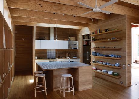 Local Wood Covers This Getaway for Two Architects Australian tallowwood kitchen with Artek stools and Muuto lighting