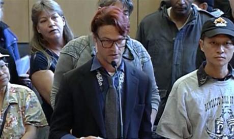 Seattle’s “Jungle” residents list demands in front of Seattle council Andrew Collins reads his demands/Seattle Channel photo