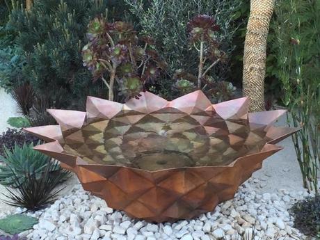 Copper bowl echoing a Fibonacci number in the Beauty of Mathematics Garden