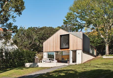 This Former Garage Is Clutter Free Modern home with brick base and cedar rain screen on top level