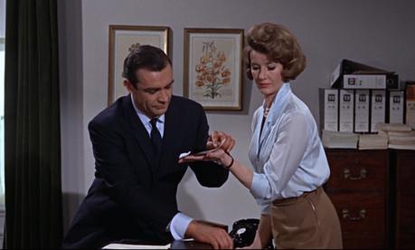 From Russia With Love – Bond’s Dark Navy Office Suit Moneypenny sizes up her competition.