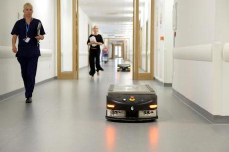 Minimum wage hikes hasten replacement of human workers by robots robot delivers food in hospital ward