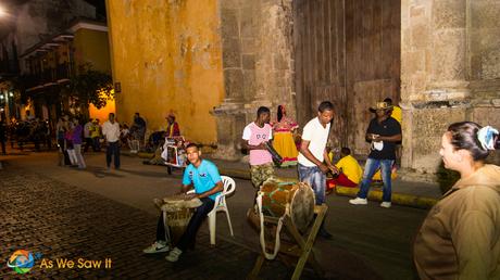 Street entertainers play for tips as night-goers find Cartagena fun and exciting.