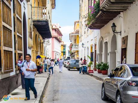 Bustling tourists and local workers scrambling along the narrow streets of Cartagena.