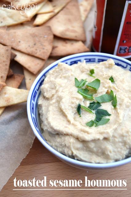 houmous or hummus made with toasted sesame oil and served with homemade corn tortilla chips