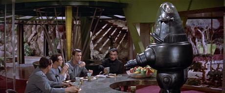 Robby the Robot serving Morbius (center) and the officers of C-57D