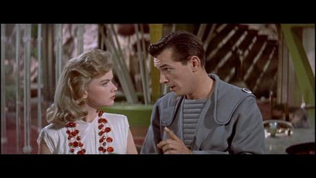 Alta (Anne Francis) being lectured to by Farman (Jack Kelly)