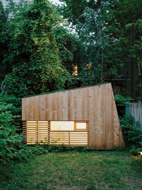Modern Brooklyn backyard studio with plexiglass skylight, green roof, and cedar cladding facade