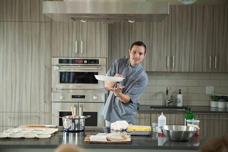 Chef Jon conducts a product demonstration at the Monogram Modern Home.