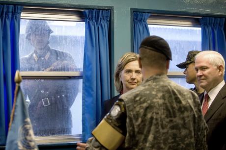 A North Korean Soldier looks in through the window of the T2 building as Secretary of State Hillary Clinton and Defense Secretary Robert M. Gates tour the Demilitarized Zone (DMZ) in Korea, July 21, 2010. Defense Department photo by Cherie Cullen 