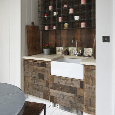 Rustic kitchen design idea: Belfast sink / Butler's Sink with recycled fruit crate cupboards, and industrial style wire shelving. recycled kitchen idea