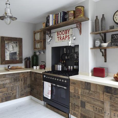 Beautiful vintage rustic style kitchen with cupboard doors made from recycled fruit crates and repurposed floor boards. Beautiful old fisherman style pendant light, and repurposed shelving., and double oven nook. kitchen made from fruit crates