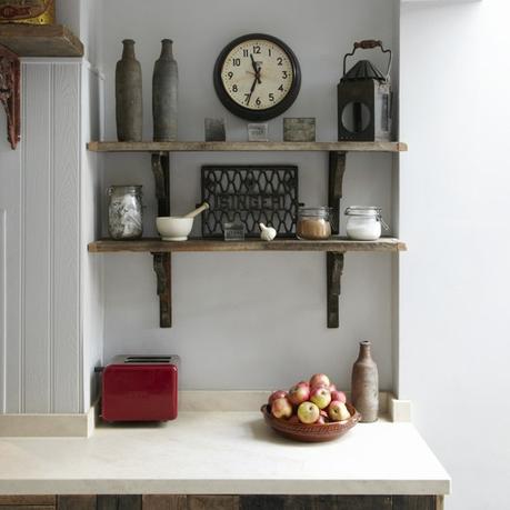 Vintage style kitchen design idea: reclaimed shelving and repurposed antiuques. Love the antique clock and vases! reclaimed kitchen shelves