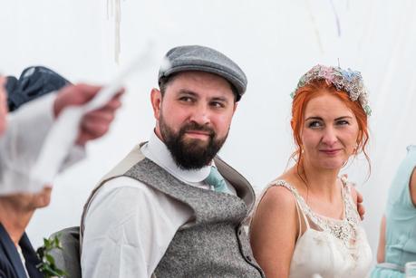Rustic Wedding with Adam + Jaclyn bride and groom listening to the best mans speech