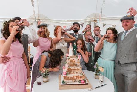 Rustic Wedding with Adam + Jaclyn wedding party having a shot of sambuca