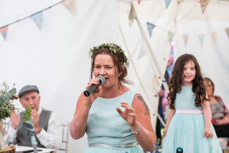 Rustic Wedding with Adam + Jaclyn bridesmaid singing at a summer wedding