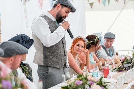 Rustic Wedding with Adam + Jaclyn a bride listening to her husbands wedding speech