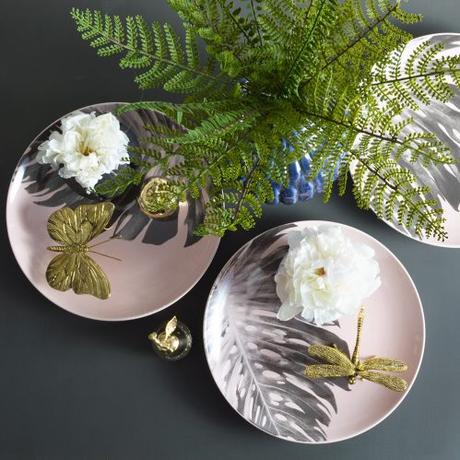 One of our top tips for styling is to use objects such as a tray, or a plate, like this pretty palm leaf plate, to place the objects on. This helps to unify individual objects and create a much more cohesive look.