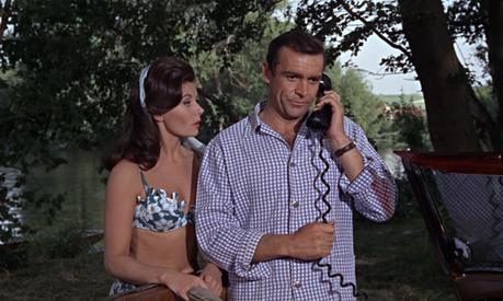 From Russia With Love – Bond’s Gingham Shirt and Swim Trunks Bond gets a mouthful from Miss Moneypenny over the car phone. Lois Maxwell had originally been offered the part of Sylvia Trench but turned it down, feeling more comfortable in the role of Moneypenny.