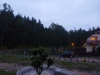 Backpacking in Poland: One Night in The Countryside Village of Rywałd, Pomerania Evening view from the front of Jacek's place in Rywałd.