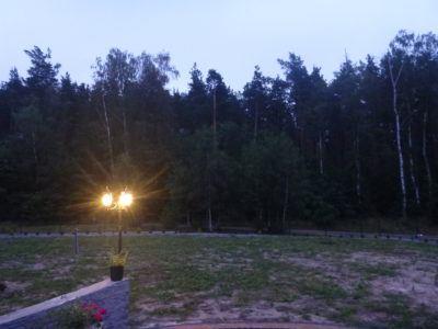Backpacking in Poland: One Night in The Countryside Village of Rywałd, Pomerania Evening view from the front of Jacek's place in Rywałd.