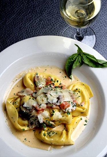 Tortellini Corleone is a signature dish on a menu packed with a fusion of coastal cuisine, Southern Creole spice and Italian classics.