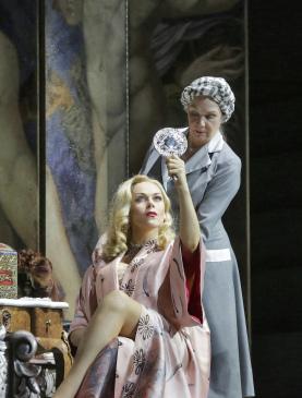 Kristine Opolais as Manon Lescaut attending to her makeup, in Act II (Photo: Ken Howard)