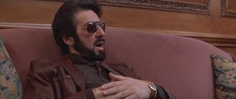 Carlito Brigante’s Brown Leather Jacket Gold drips from Carlito's face and fingers while he talks to his attorney.