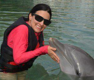 The Educational Tourist with dolphin, Swim with Dolphins