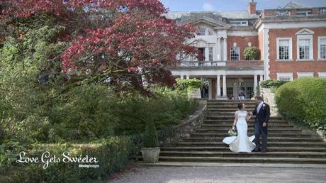 bride and groom walking around the gardens at Eaves Hall for wedding videographer