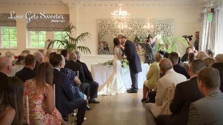 first kiss as husband and wife during weddingceremony at eaves hall videography
