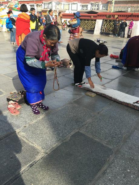 The Roof of the World: Why Travelling to Tibet Should Be On Your Bucket list! jokhang-temple-prayers