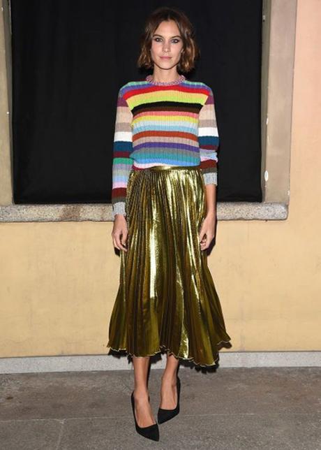 Alexa Chung Pairs A Multicolor Striped Sweater With Pleated Gold Skirt
