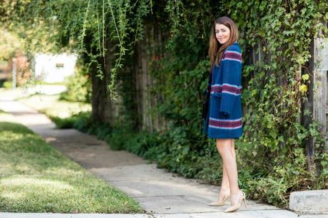 Amy havins the perfect holiday coat and dress for holiday parties.