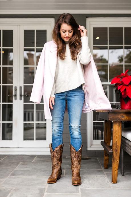 Amy Havins wears a winter coat paired with Justin Cowboy Boots.