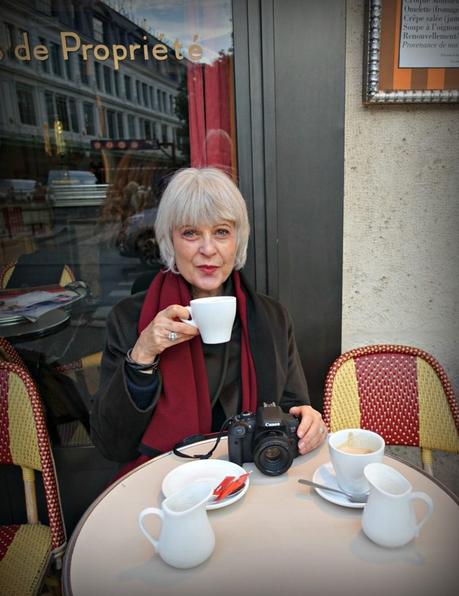 Josephine enjoying a coffee at a Paris cafe