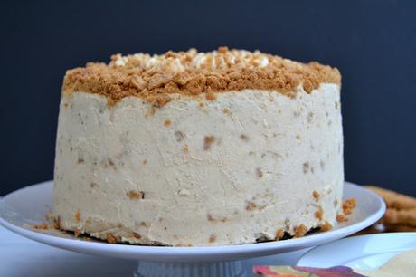 Dark gingerbread cake with cream cheese frosting incorporating crushed ginger nut biscuits
