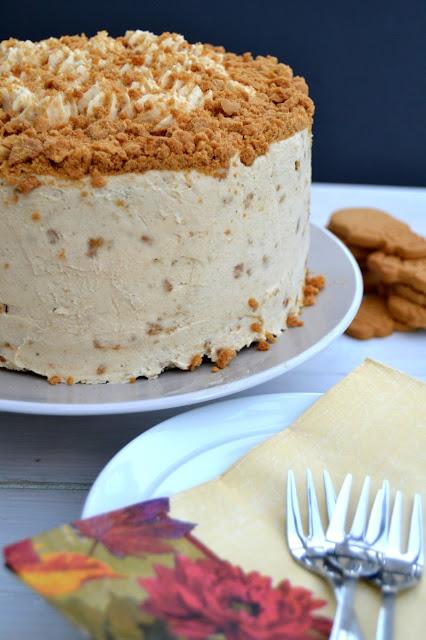 Dark gingerbread cake with cream cheese frosting incorporating crushed ginger nut biscuits