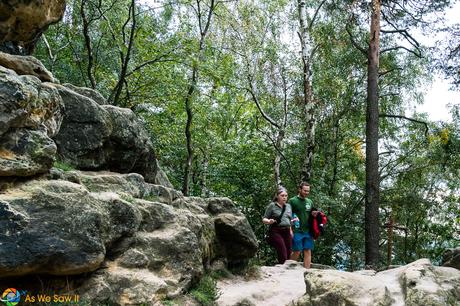 Linda and Vitek hike on a path in Bohemian Switzerland State Park, Czech Republic