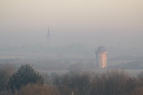 Water Tower and Church at Castlethorpe through the mist