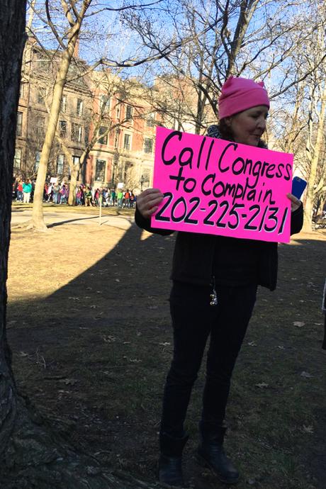 Protester Holds Sign Urging All To Call Congress At Boston Women's March