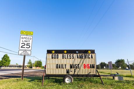 God bless America sign next to speed limit sign in Ft. Wayne Indiana