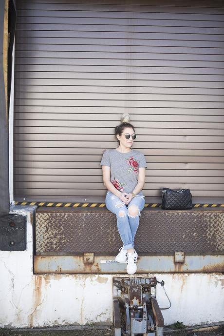 Embroidered roses tee paired with jeans and tennis for a comfortable but chic daytime look. 