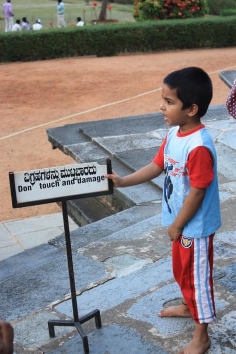 DAILY PHOTO: Little Boy Touching the “Do Not Touch” Sign